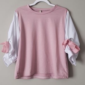 Pink and white blouse with bow detail on sleeve